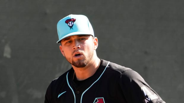 Slade Cecconi gets ready to throw a pitch during a bullpen session as part of workouts at Salt River Fields.